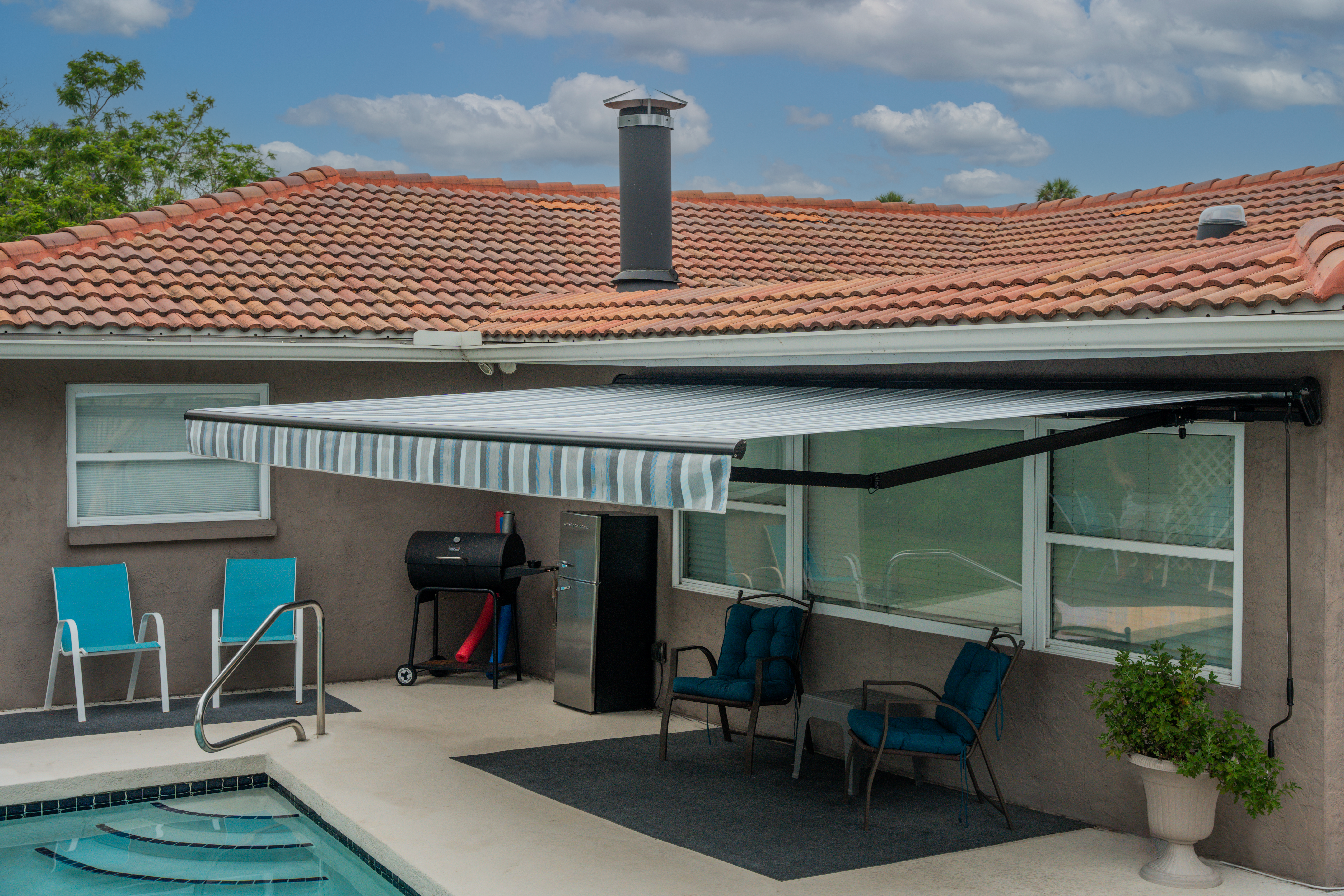 Awning-Residential-TanStucco-TerracottaRoof-MarcoBlueGrey